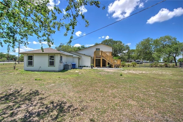 2322 Violet, Corpus Christi, TX 78410 - back of house with a wooden deck, stairway, and central AC