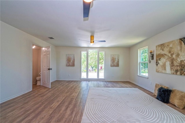 2322 Violet, Corpus Christi, TX 78410 - unfurnished bedroom with wood finished floors, baseboards, and a ceiling fan