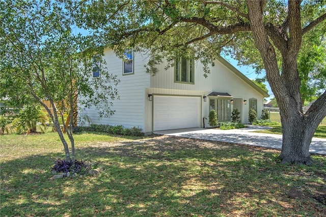 2322 Violet, Corpus Christi, TX 78410 - view of front of house with concrete driveway, a front yard, and a garage