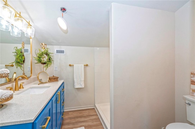 2322 Violet, Corpus Christi, TX 78410 - full bath with wood finished floors, toilet, vanity, walk in shower, and baseboards