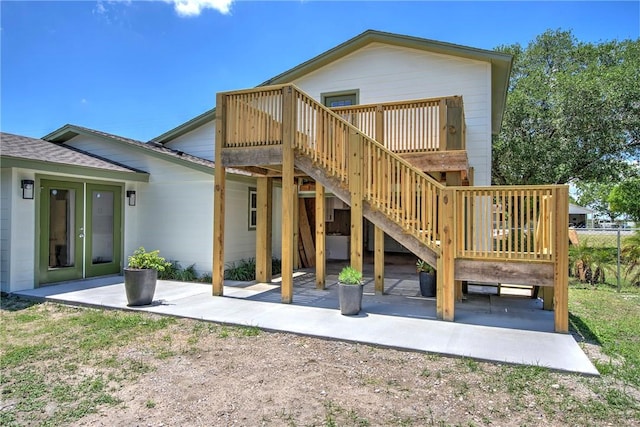2322 Violet, Corpus Christi, TX 78410 - back of house featuring a patio area, a deck, roof with shingles, and stairs