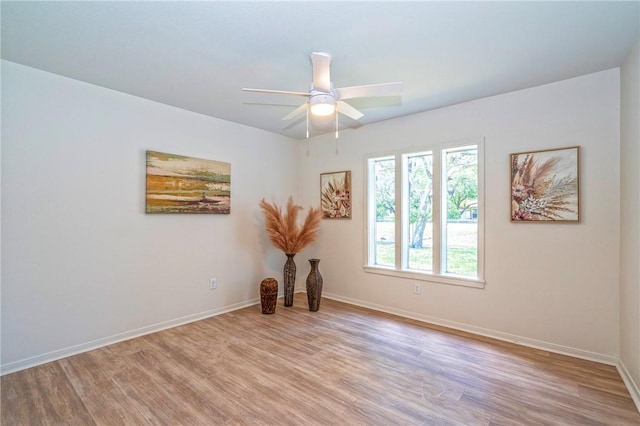 2322 Violet, Corpus Christi, TX 78410 - unfurnished room with light wood-type flooring, ceiling fan, and baseboards