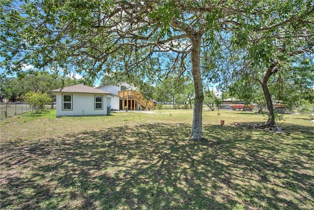 2322 Violet, Corpus Christi, TX 78410 - view of yard featuring stairway and a wooden deck