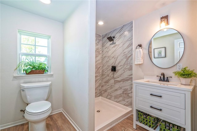 2322 Violet, Corpus Christi, TX 78410 - full bathroom featuring tiled shower, toilet, wood finished floors, and recessed lighting