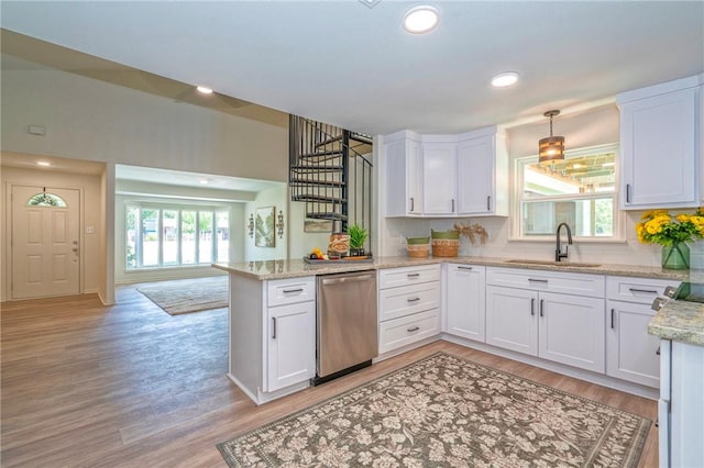 2322 Violet, Corpus Christi, TX 78410 - kitchen featuring dishwasher, a peninsula, a sink, white cabinets, and recessed lighting