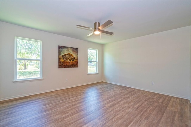 2322 Violet, Corpus Christi, TX 78410 - unfurnished room featuring wood finished floors, a ceiling fan, and baseboards