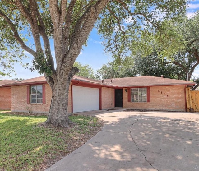 4113 Sierra St, Corpus Christi, TX 78410 - single story home with brick siding, driveway, and a garage