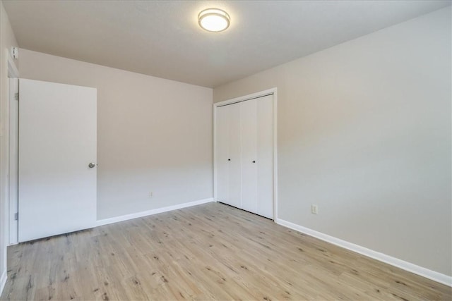 4113 Sierra St, Corpus Christi, TX 78410 - unfurnished bedroom with light wood finished floors, a closet, and baseboards