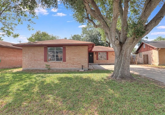4113 Sierra St, Corpus Christi, TX 78410 - ranch-style house with brick siding, a front lawn, and concrete driveway