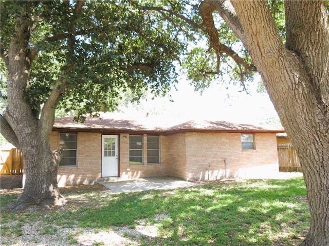 4113 Sierra St, Corpus Christi, TX 78410 - rear view of house featuring brick siding and a patio