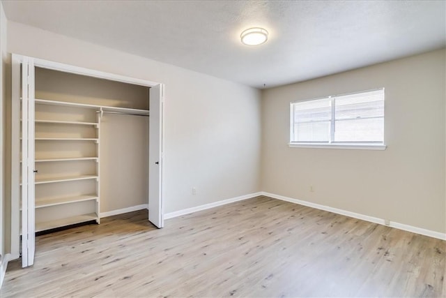 4113 Sierra St, Corpus Christi, TX 78410 - unfurnished bedroom with wood finished floors, baseboards, and a closet