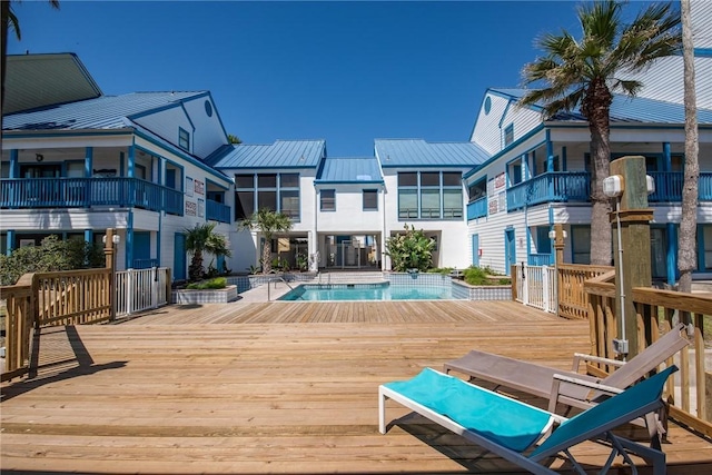 view of swimming pool with a wooden deck