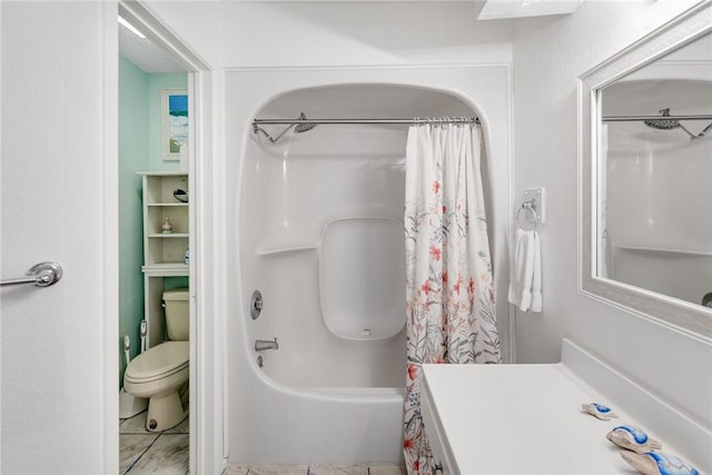 bathroom featuring shower / bath combo and toilet