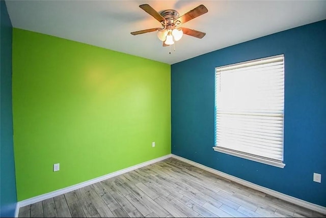 1325 S Mccampbell St, Aransas Pass, TX 78336 - spare room featuring a ceiling fan, wood finished floors, and baseboards