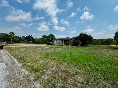 view of yard with a rural view