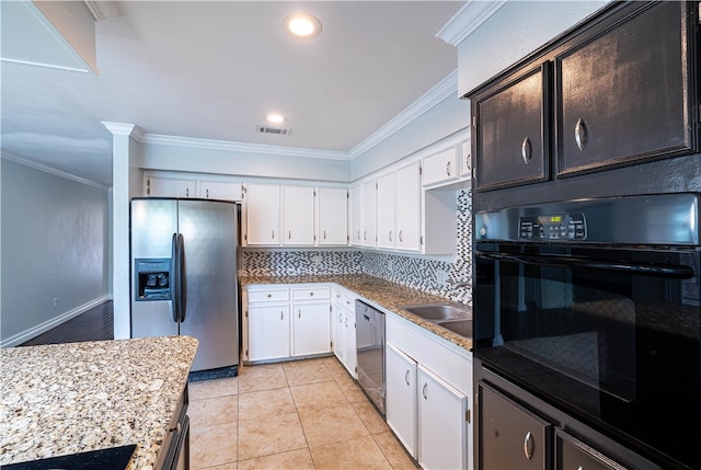 kitchen with white cabinetry, ornamental molding, and stainless steel appliances