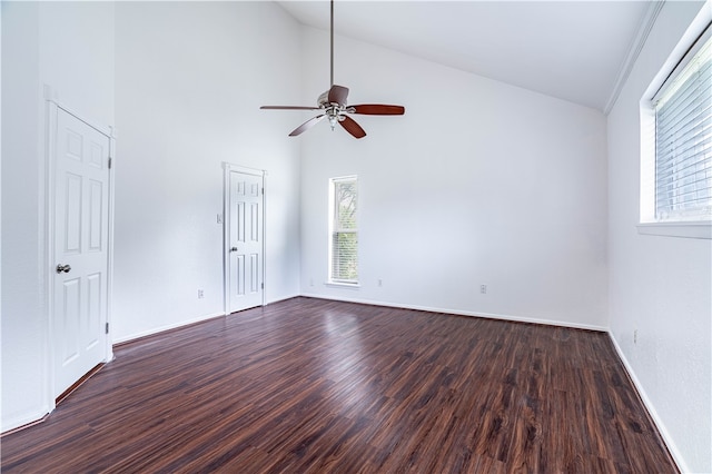 spare room with high vaulted ceiling, ceiling fan, and dark wood-type flooring