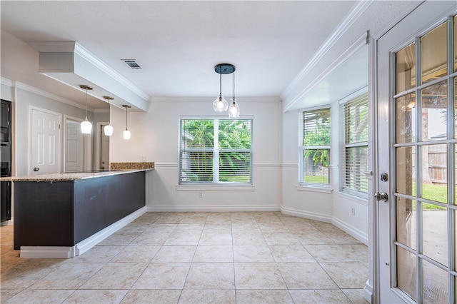 kitchen with kitchen peninsula, light tile patterned floors, pendant lighting, and ornamental molding