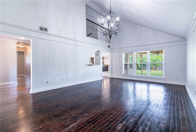 unfurnished living room with a chandelier, dark hardwood / wood-style floors, high vaulted ceiling, and ornamental molding