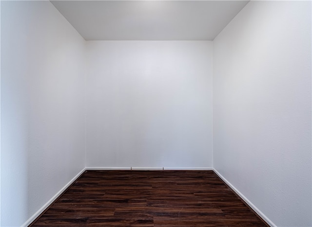 unfurnished room featuring dark hardwood / wood-style flooring