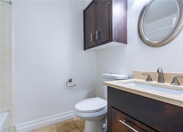 bathroom with tile patterned floors, vanity, and toilet