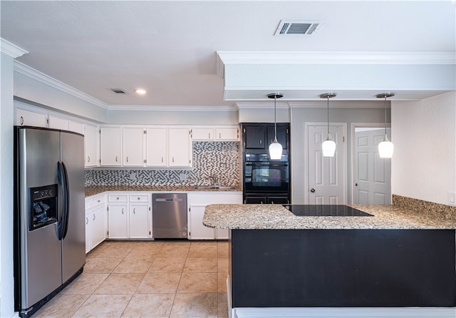 kitchen with kitchen peninsula, tasteful backsplash, black appliances, white cabinetry, and hanging light fixtures