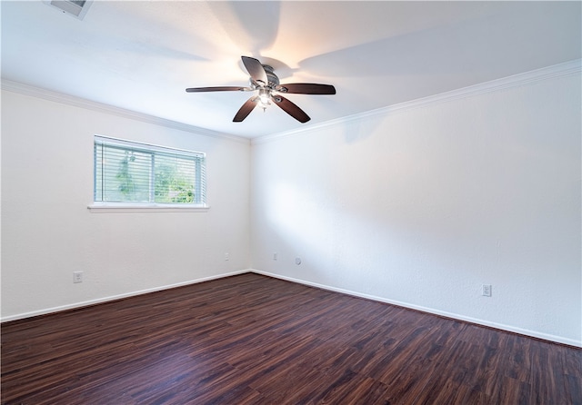 empty room featuring dark hardwood / wood-style flooring, ceiling fan, and ornamental molding