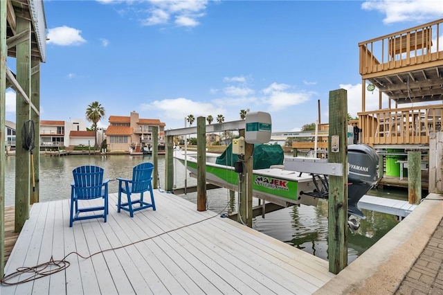 dock area featuring a water view and boat lift