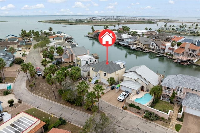 birds eye view of property featuring a water view and a residential view