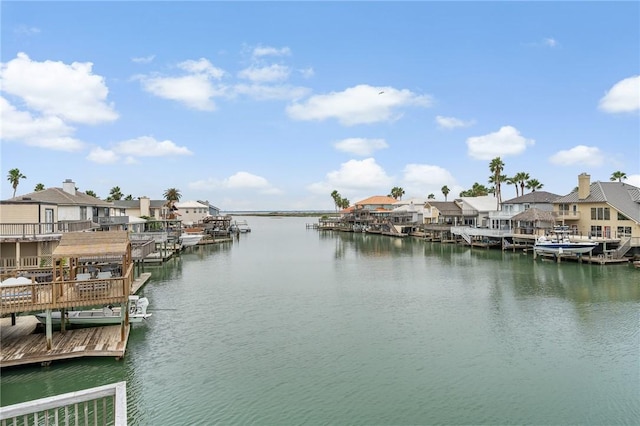 view of dock with a water view and a residential view