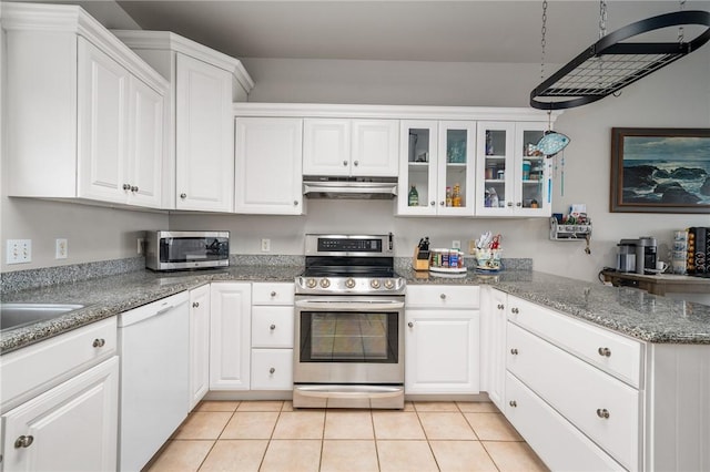 kitchen featuring stainless steel appliances, white cabinetry, glass insert cabinets, and under cabinet range hood