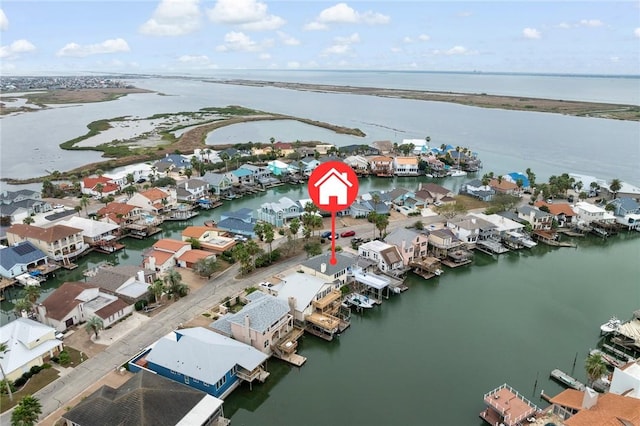 drone / aerial view featuring a water view and a residential view