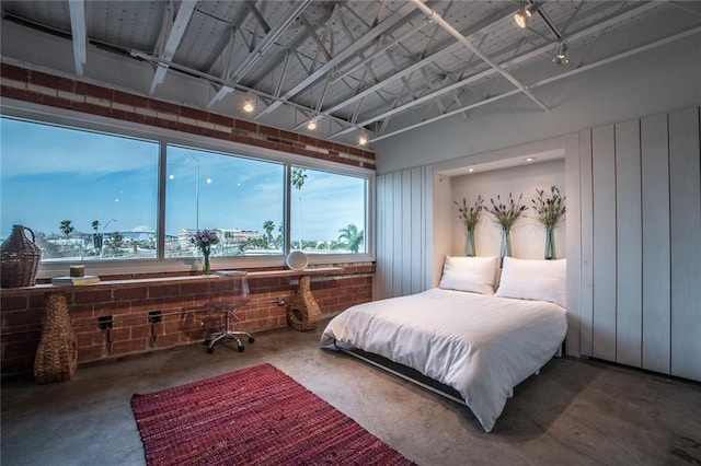 901 N Upper Broadway St Unit 206, Corpus Christi, TX 78401 - bedroom with concrete flooring and multiple windows