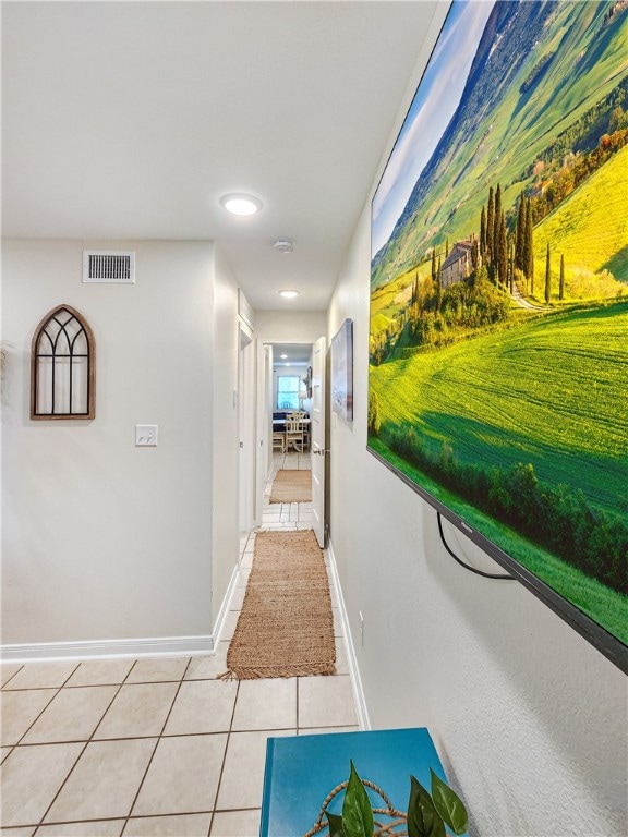 corridor featuring light tile patterned floors