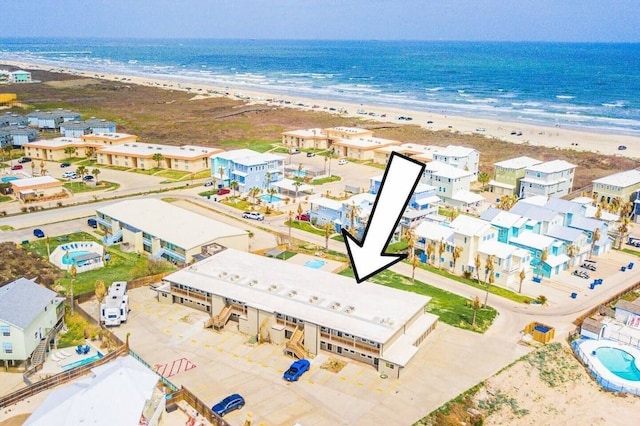 aerial view with a view of the beach and a water view