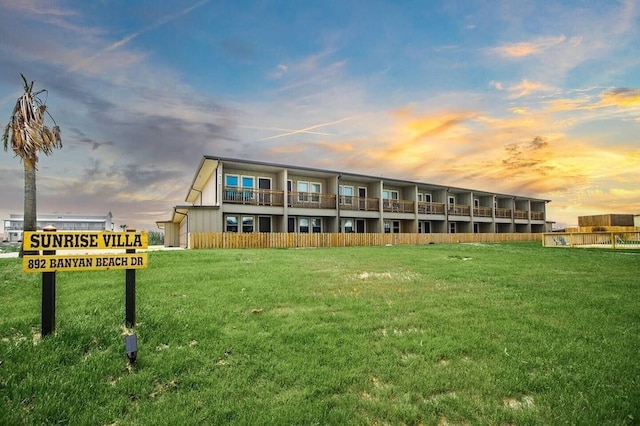 view of outdoor building at dusk