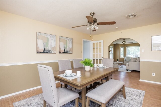 dining room with hardwood / wood-style floors and ceiling fan