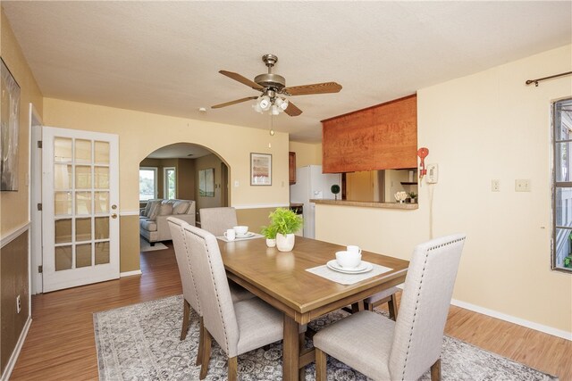 dining area featuring hardwood / wood-style floors and ceiling fan