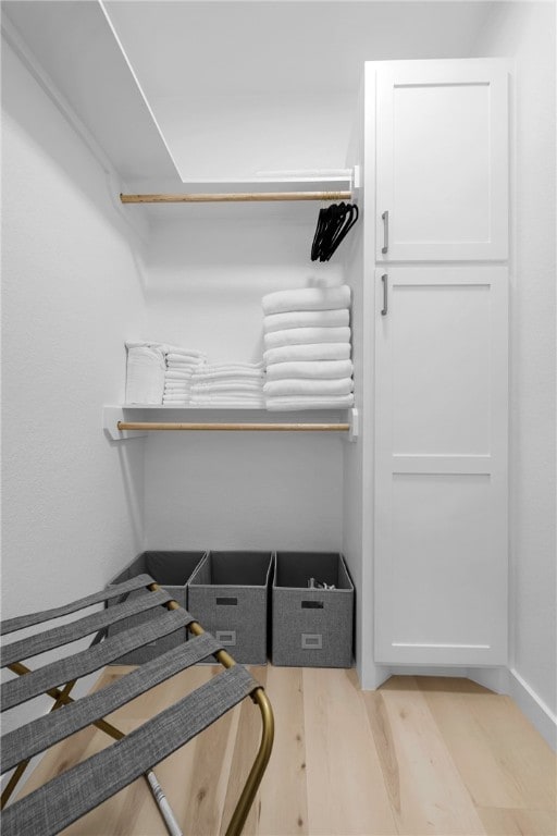 spacious closet featuring light wood-type flooring