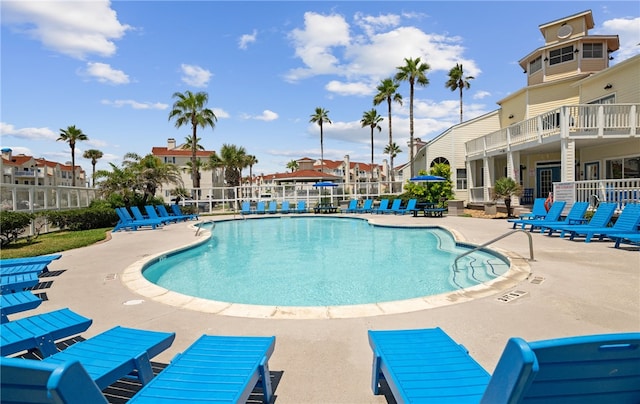 view of swimming pool featuring a patio area