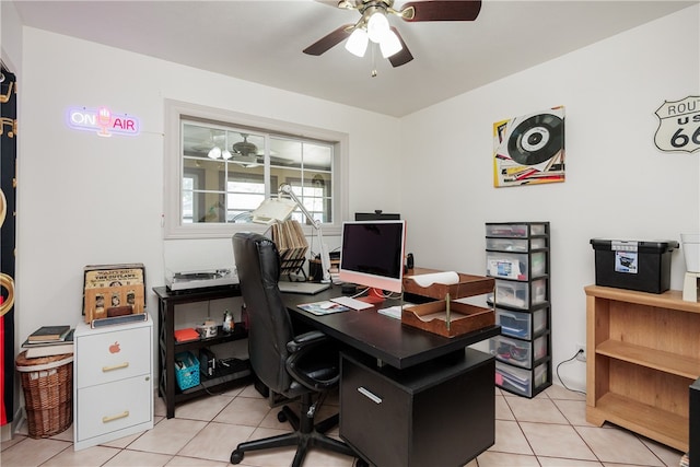 tiled office space featuring ceiling fan