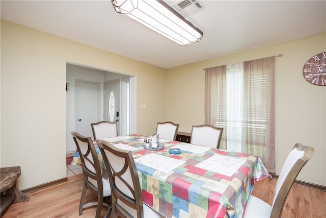 dining room with light hardwood / wood-style flooring