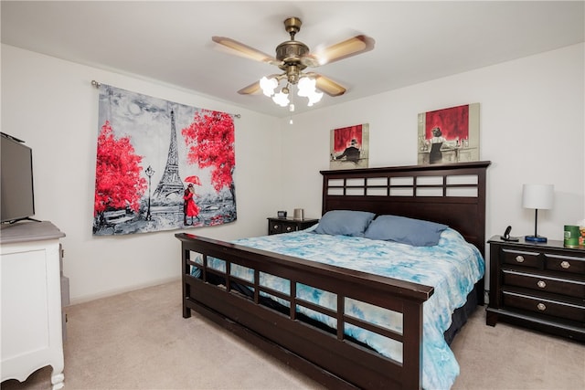 bedroom featuring light colored carpet and ceiling fan