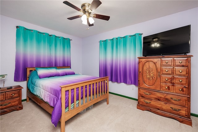 bedroom with light colored carpet and ceiling fan