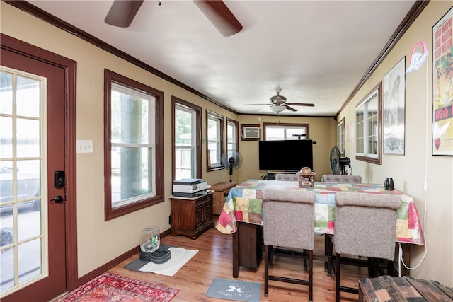 dining area with hardwood / wood-style floors, ceiling fan, an AC wall unit, and ornamental molding