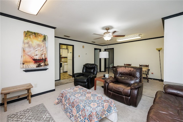 living room featuring ornamental molding, light carpet, and ceiling fan