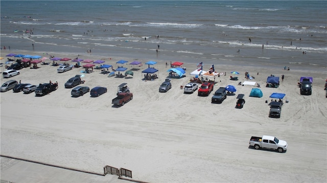 bird's eye view featuring a beach view and a water view