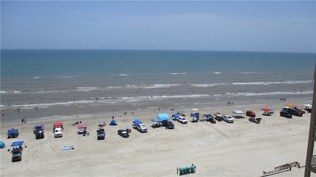 birds eye view of property with a beach view and a water view