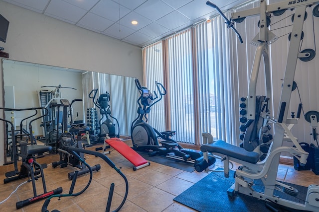 exercise room with a drop ceiling