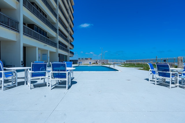 view of swimming pool featuring a patio